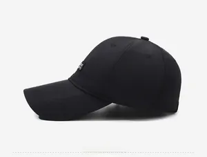 Side view of black baseball cap with rectangle letter patch and six-panel structure