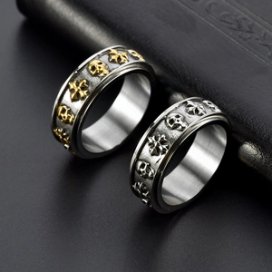 Vintage skull and cross rotatable punk ring in silver and gold-tone titanium steel