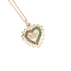 Gold heart pendant necklace with green crystal eye motif on white background