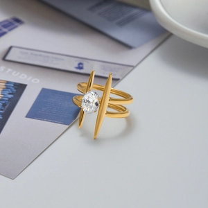 Detail of 18K gold-plated double-layer ring featuring a central oval zircon stone
