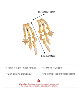 Detailed view of gold hoop earrings with star moon and arrow zircon pendants and dimensions