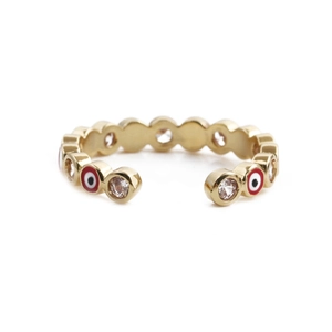 Macro detail of gold evil eye open ring with colorful enamel and cubic zirconia