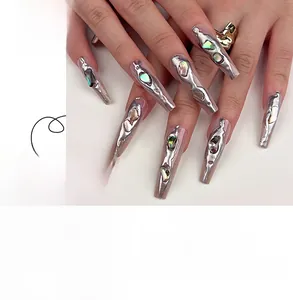 Detail of 3D silver liquid metal press-on nails with shiny seashell fragments