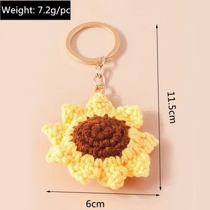 Detail of handmade crochet sunflower keychain showing 6cm diameter and 11.5cm total length