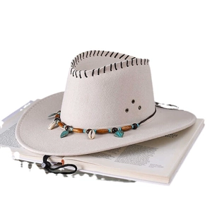 Beige cowboy hat with bohemian shell pendants and leaf charms with chin strap