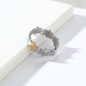 Detail of creative puzzle ring in silver and gold steel with unique shadow effect