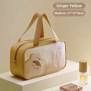 Detail of yellow waterproof toiletry bag with cartoon animal pattern and sturdy top handle