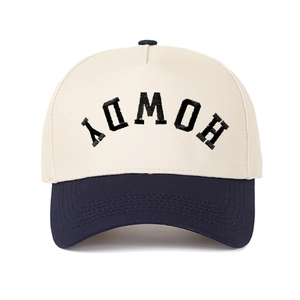 Two-tone baseball cap with HOWDY embroidery and navy brim on cream crown