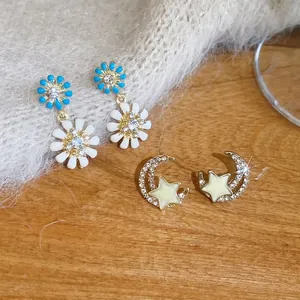 Elegant floral daisy and star moon stud earrings set with sparkling crystals