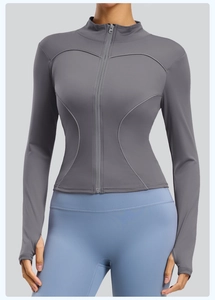 Detail of grey slim fit running jacket with stand collar and functional thumbholes