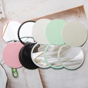 Portable round folding makeup mirrors in pink, black, white, and mint green colors