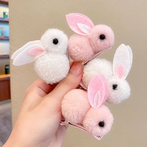 Cute plush bunny hair clips for girls in white and pink colors for autumn and winter hair styling
