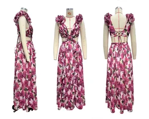 Detailed view of floral maxi dress with deep V-neck, waist cut-outs and ruffled shoulders