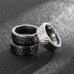 Retro stainless steel rings for men featuring unique hammered textures in silver tones
