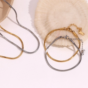 Detail of 18K gold plated hexagonal snake chain with K18 hallmark on metal tag