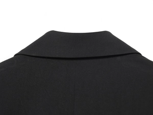 Close-up of the professional back seam and collar stitching on a black padded blazer