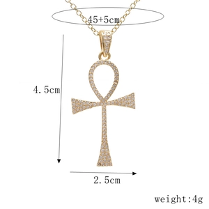 Detailed view of gold Ankh cross pendant with measurements 4.5x2.5cm and 4g weight