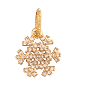 Detailed view of gold-plated snowflake pendant with white cubic zirconia and size dimensions
