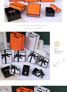 Detailed view of orange jewelry boxes with black borders for earrings and necklaces