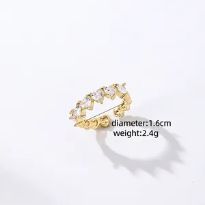 Detail view of gold open ring with heart-shaped zircons and 1.6cm diameter size