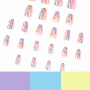 Press-on nails featuring colorful wave patterns, small white flowers and rhinestones