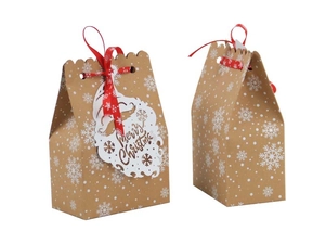 Christmas kraft paper gift bag with white snowflakes, red ribbon and Santa Claus tag