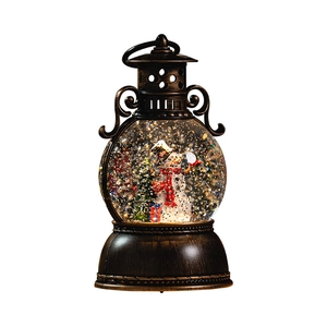 Vintage bronze musical Christmas lantern with snowman scene and swirling glitter