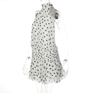 Close-up of halter neck tie and pleated waist on white polka dot A-line dress