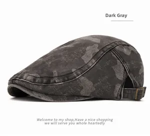 Close-up of vintage dark grey camo flat cap with bronze metal adjustment buckle