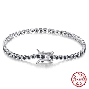 Detailed macro of S925 sterling silver tennis bracelet with round black zircon stones