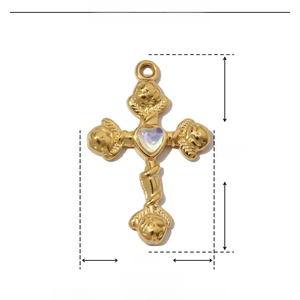 Detailed view of a gold stainless steel cross pendant with rose and resin heart center