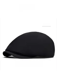 Close-up of black quick-dry flat cap with visible decorative stitching and curved brim