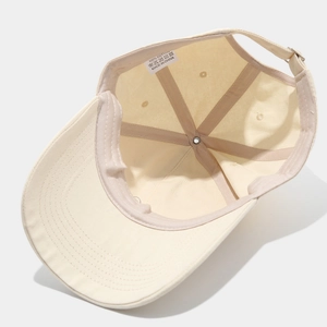 Detail view of cotton baseball cap interior showing sweatband and adjustable buckle