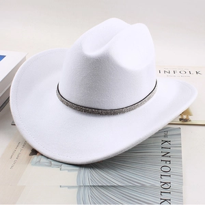 Detail of white felt cowboy hat featuring a sparkling rhinestone decorative band