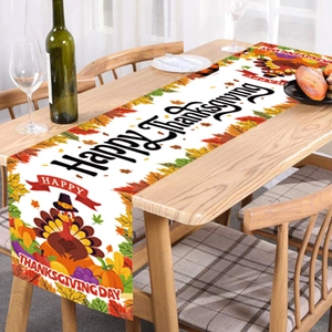Happy Thanksgiving table runner featuring turkeys and maple leaves on a rustic wooden table