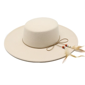 Close-up of wool boater hat with leather cord, colorful beads, and natural feather detail