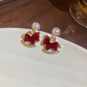 Elegant red flocked rocking horse drop earrings with pearls and crystals in gold finish