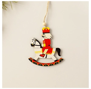 Detail of wooden nutcracker soldier on rocking horse Christmas tree hanging ornament