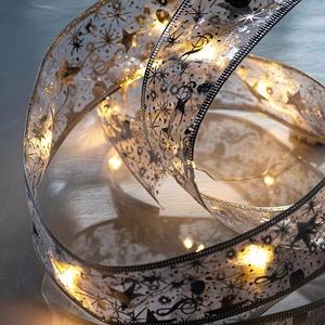 Silver mesh ribbon with LED lights and black stars for Christmas tree decor