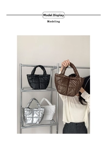 Detailed view of quilted puffer handbags in black, brown, silver, and white colors