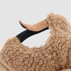 Close-up of adjustable velcro strap on warm sherpa fleece baseball cap for kids