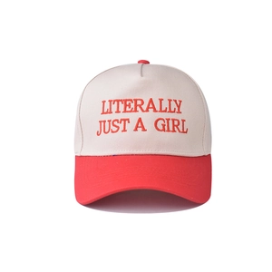 Detail of red LITERALLY JUST A GIRL embroidery on a beige cotton baseball cap