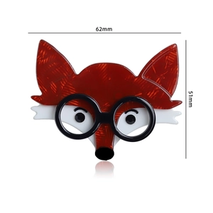 Detailed view of acrylic fox brooch with glasses, dimensions 62mm by 51mm
