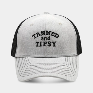 Grey and black mesh trucker hat with TANNED and TIPSY embroidery for outdoor sports