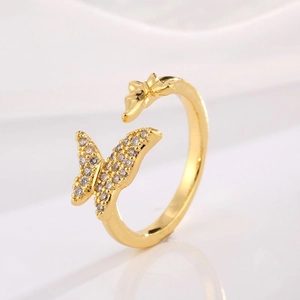Detailed view of the gold adjustable ring featuring a pavé zircon butterfly design