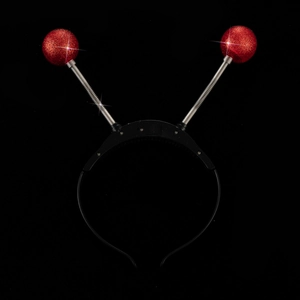 Detail showing red glitter alien eyeball headband with spring antennae and light-up battery box
