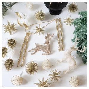 Detailed set of champagne gold glitter reindeer, stars and pinecone Christmas ornaments