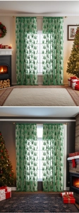 Close-up of festive forest green lace curtain featuring Christmas trees and holiday patterns