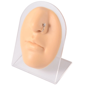 Silver flower nose ring with zircon crystals on silicone face model display stand
