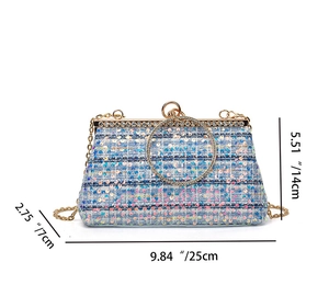 Detailed view of shimmering blue sequin clutch showing chain strap and dimensions 25x14x7cm